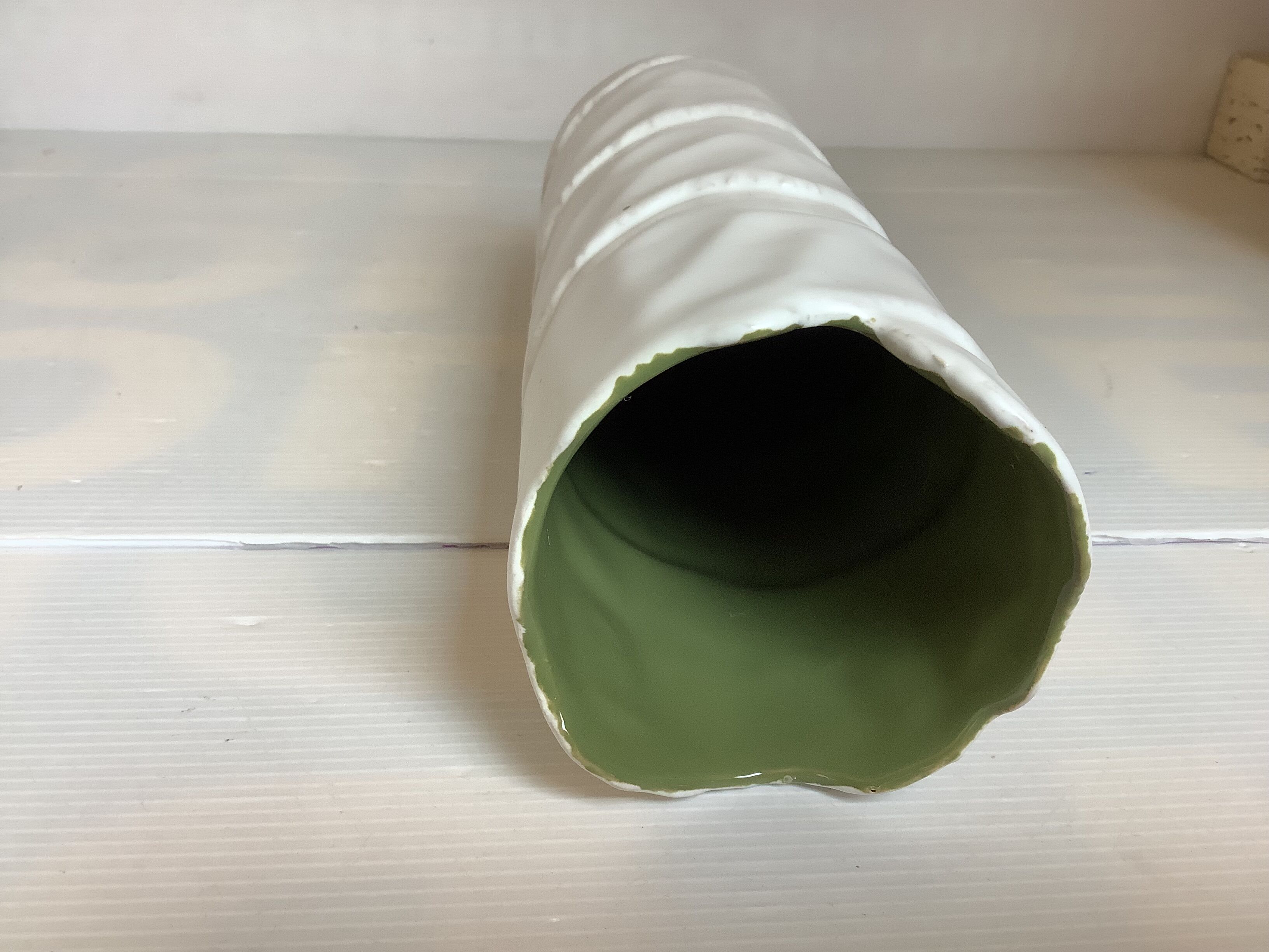 Vase with patterns of rolled paper leaves