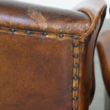 Set of 2 sheep leather wingback chairs with red corduroy seat cushions