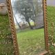 Large antique gilded mirror, wood and stucco gadroons, partially de-mercury