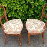 Pair of Louis XV chairs in carved walnut.