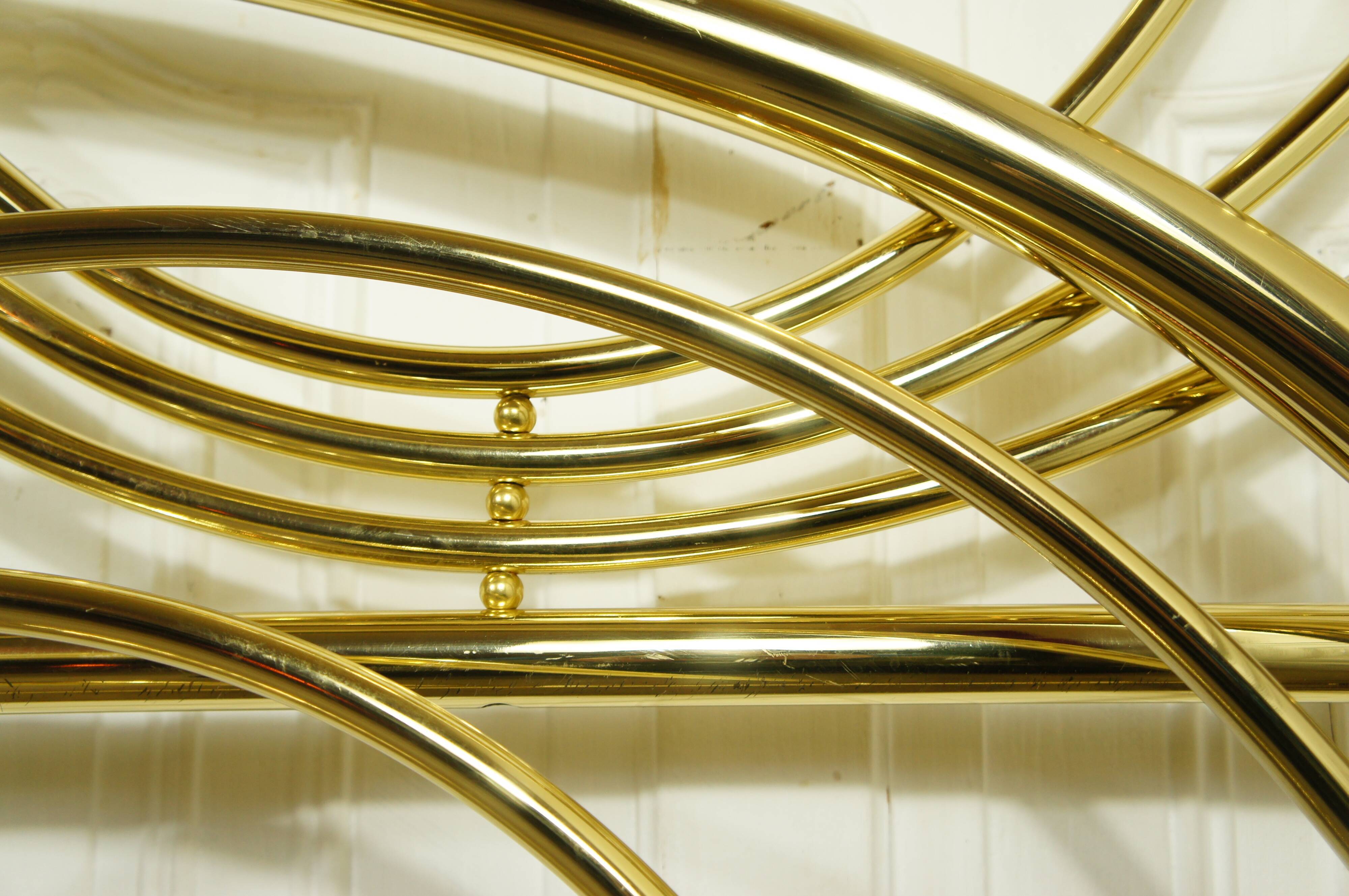 Hollywood Regency bed in gilded metal, circa 1970