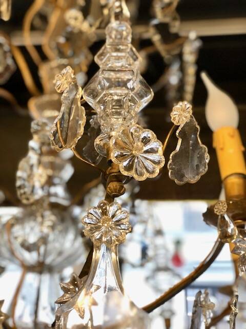 Large chandelier with tassels and old daggers