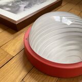 Round glass wall-mounted ceiling light porthole Prisma model Eko red.