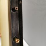 Old wall lamp, made of bakelite with a vanilla/egg colored glass shade.