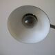 Super Chrome old articulated metal desk lamp on workshop decor base