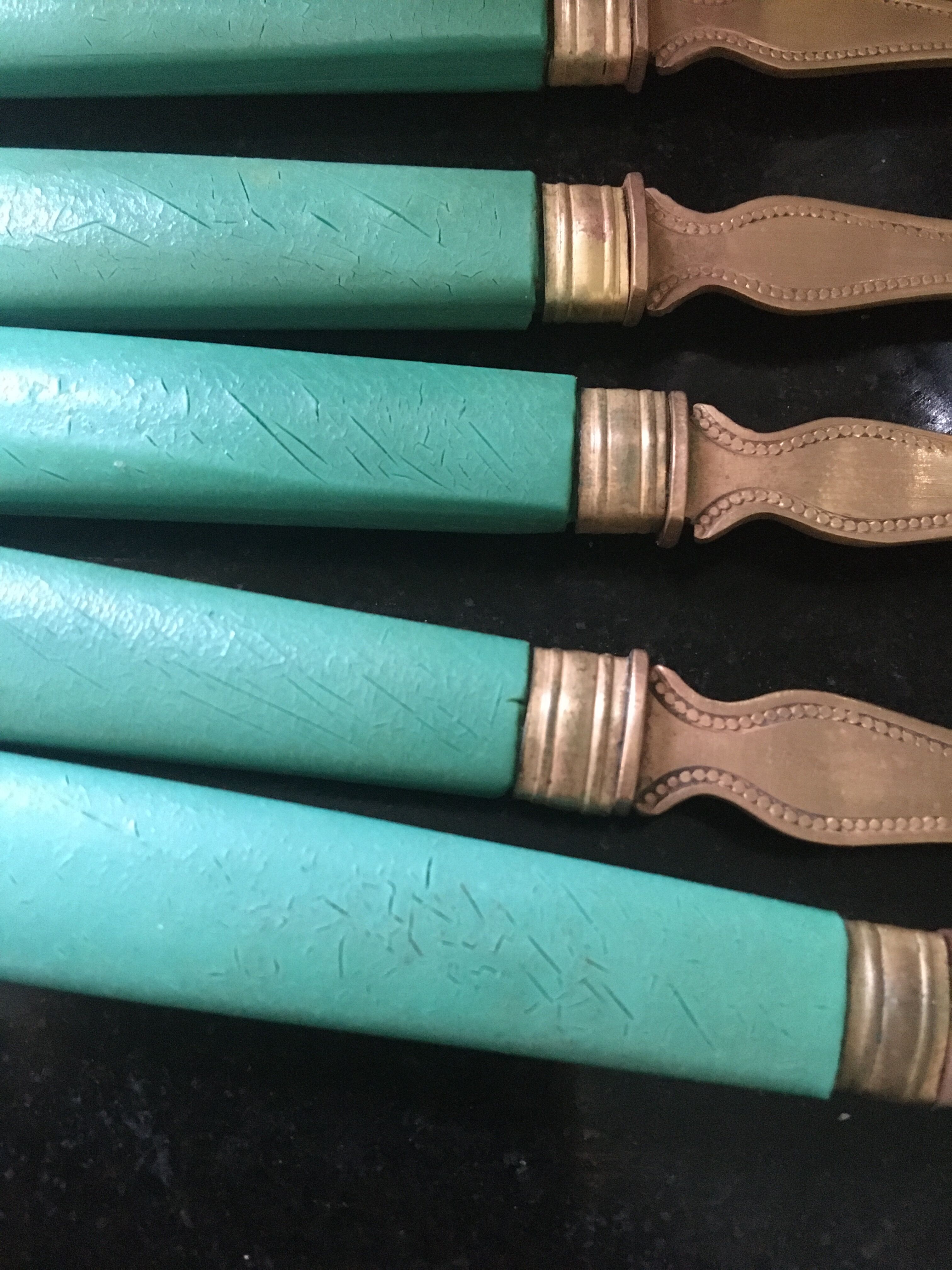 Set of brass dessert forks