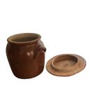 Ancient ceramic salt cellar and its lid.