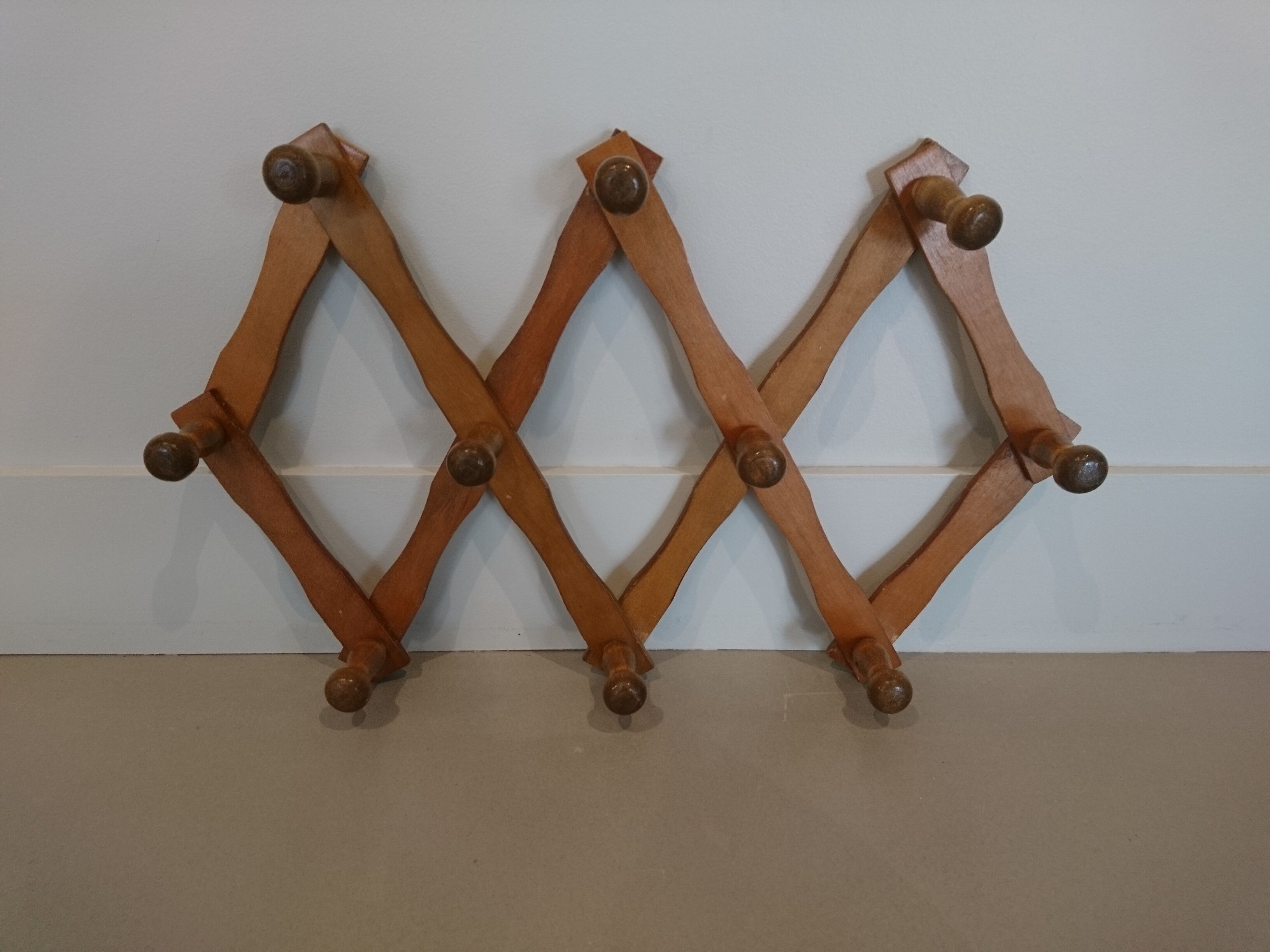 Folding wall coat rack