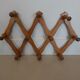 Folding wall coat rack