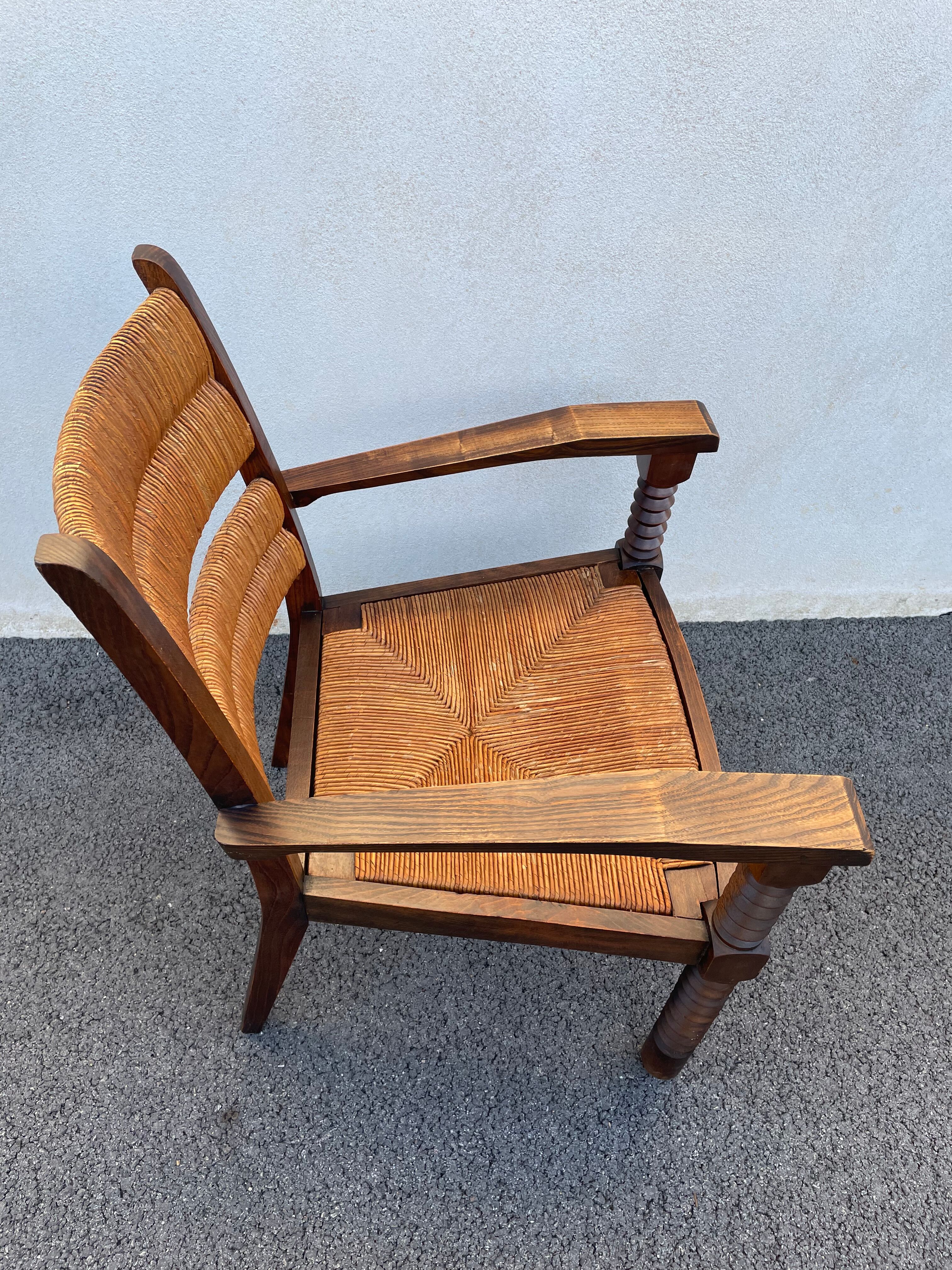 Vintage armchair in straw and brutalist wood