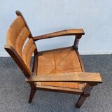 Vintage armchair in straw and brutalist wood
