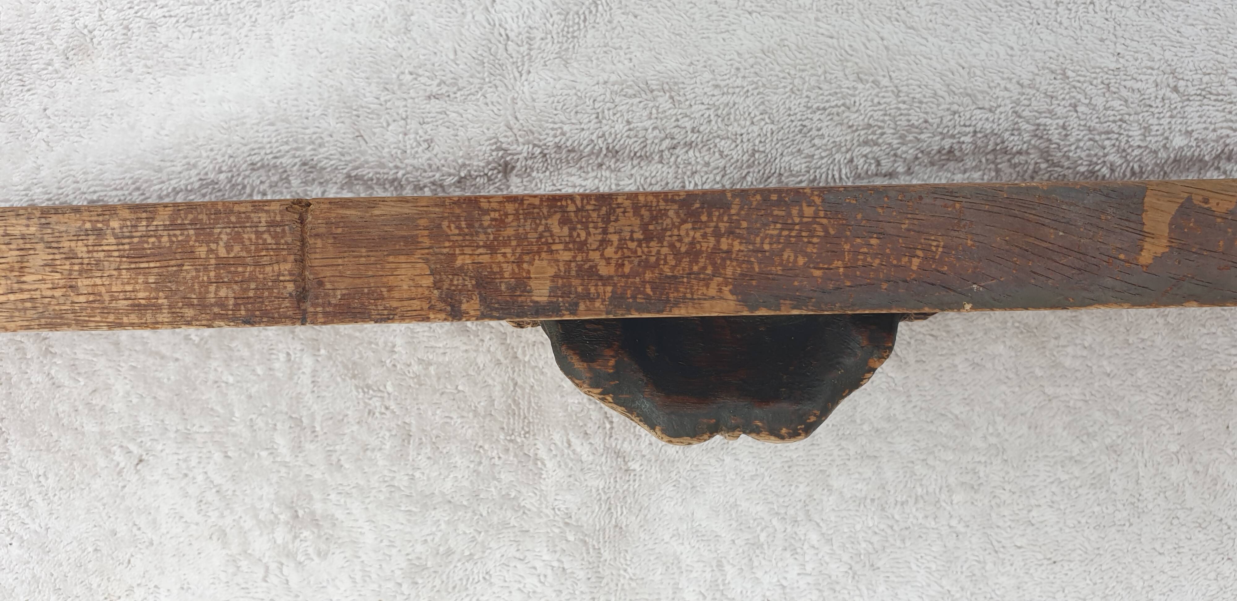 Natural wood pediment with bunches of grapes