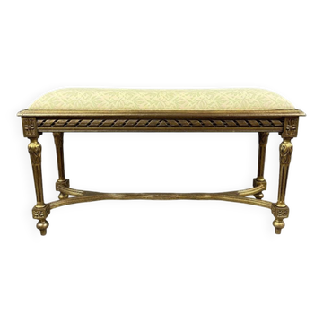 Antique gilded wooden bench in Louis XVI style, 19th century.