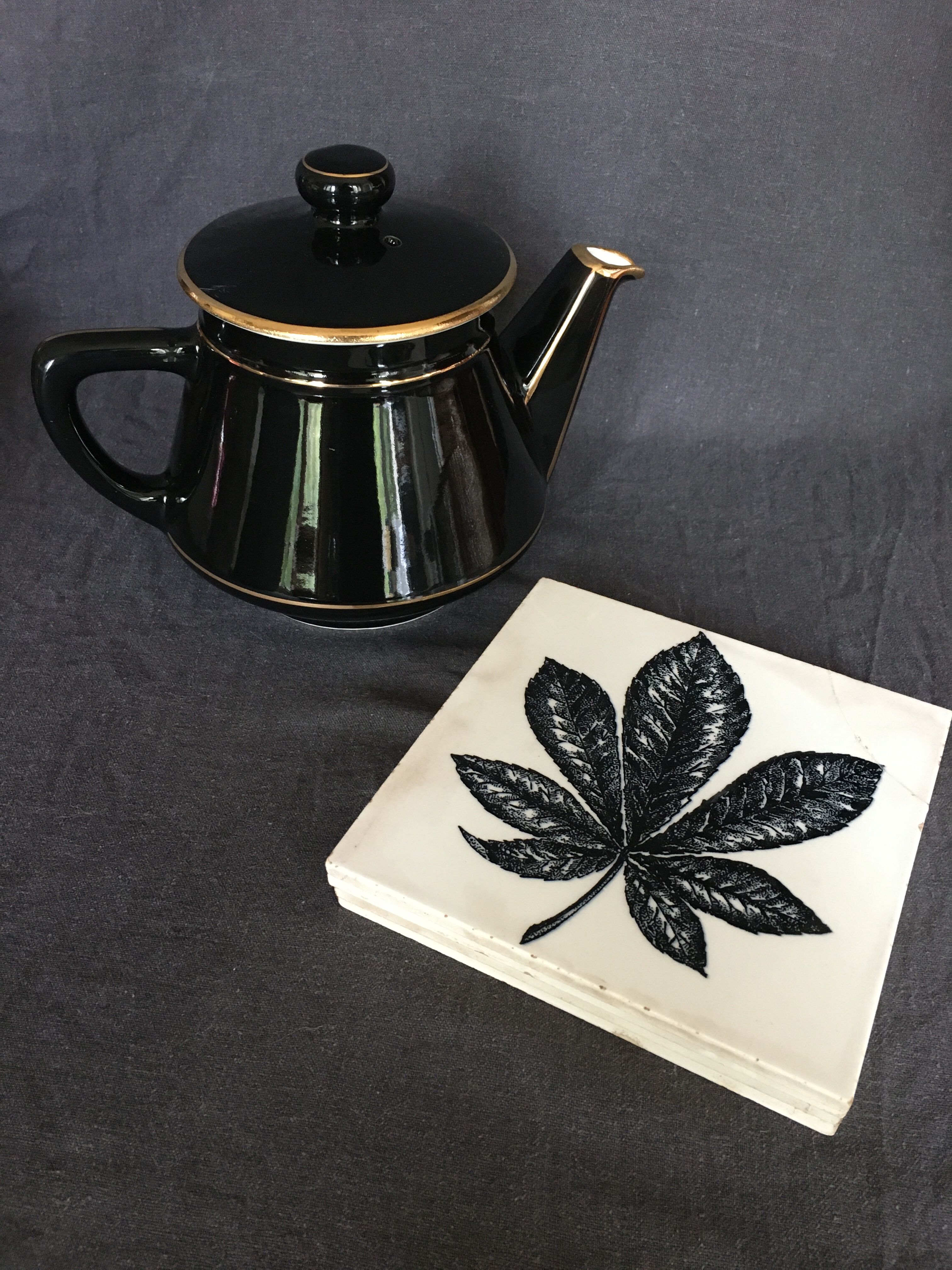 Black and gold ceramic coffee maker