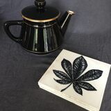 Black and gold ceramic coffee maker