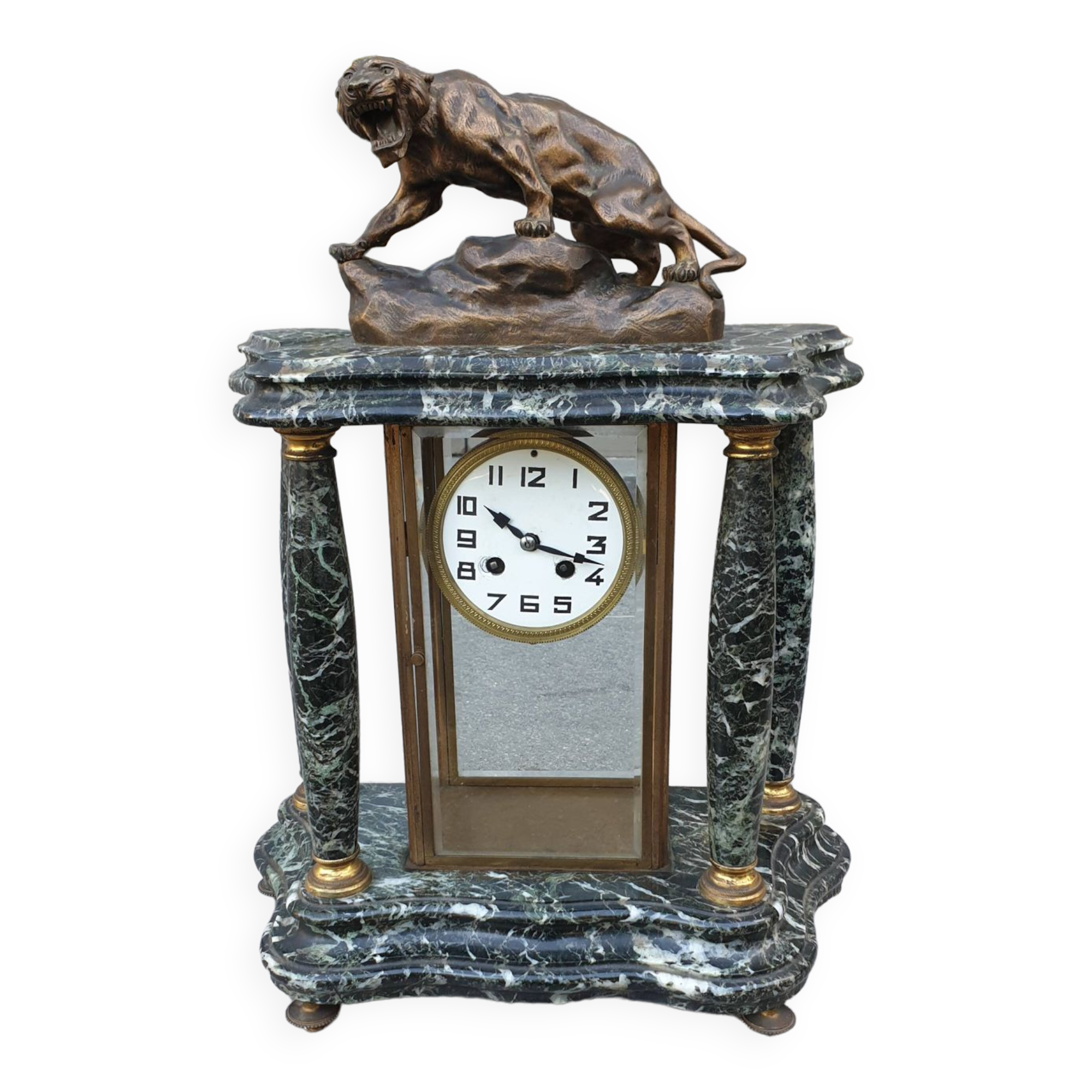 Pendule portique et cage XXème bronze signé cartier