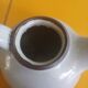Vintage artisanal style glazed pottery teapot