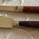 Service cutlery, brass and rosewood.