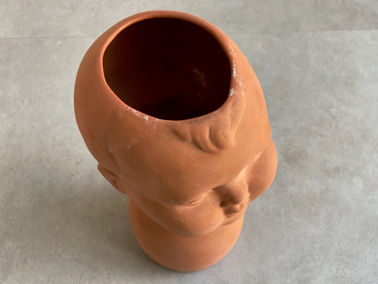 Vintage terracotta kids head vase
