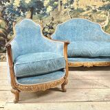 Art deco living room around 1920 in carved wood upholstered in blue velvet, a sofa two armchairs