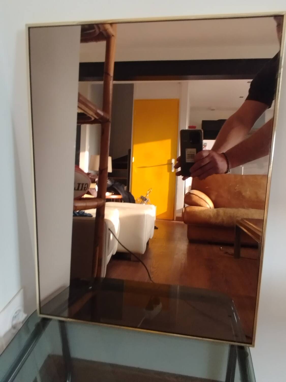 Vintage mirror in gilded brass and smoked glass. circa 1970
