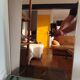 Vintage mirror in gilded brass and smoked glass. circa 1970
