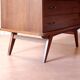 Vintage slanted commode with tapered legs from the 1960s in golden oak.