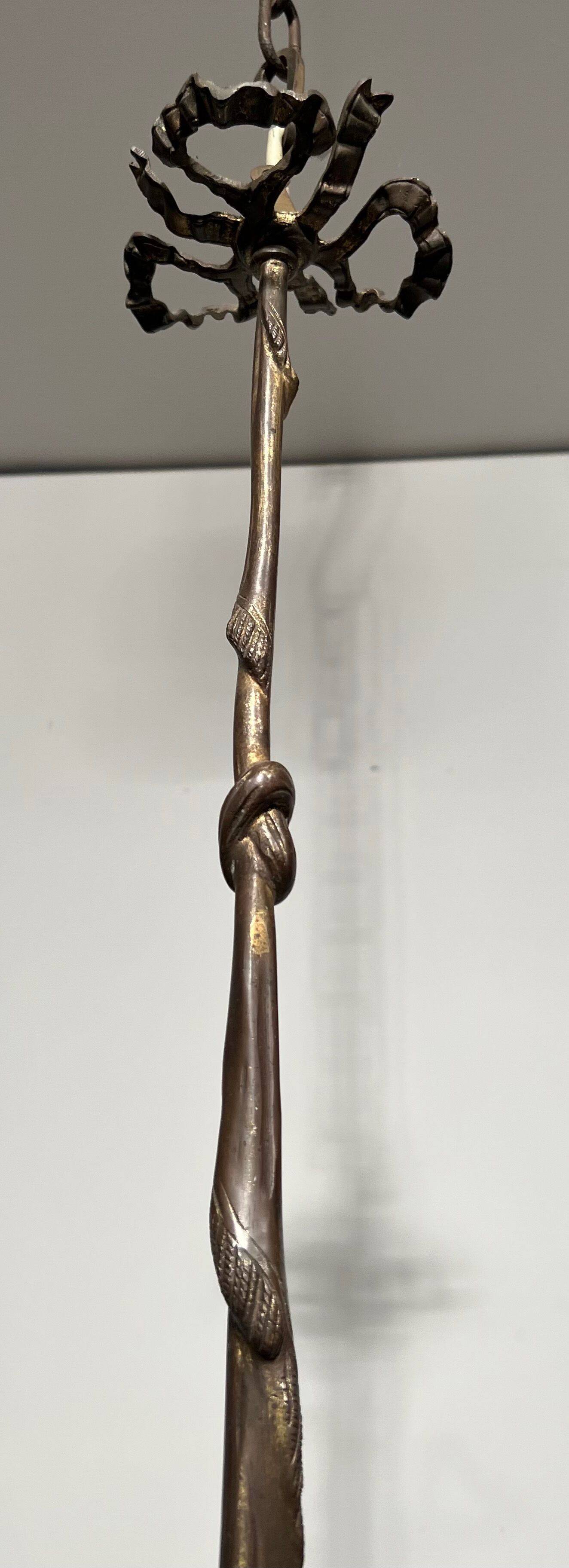 Empire-style bronze chandelier with 3 arms of light topped with eagle heads. French work. Circa 1900.