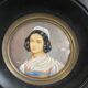 Old miniature portrait painting of a woman.