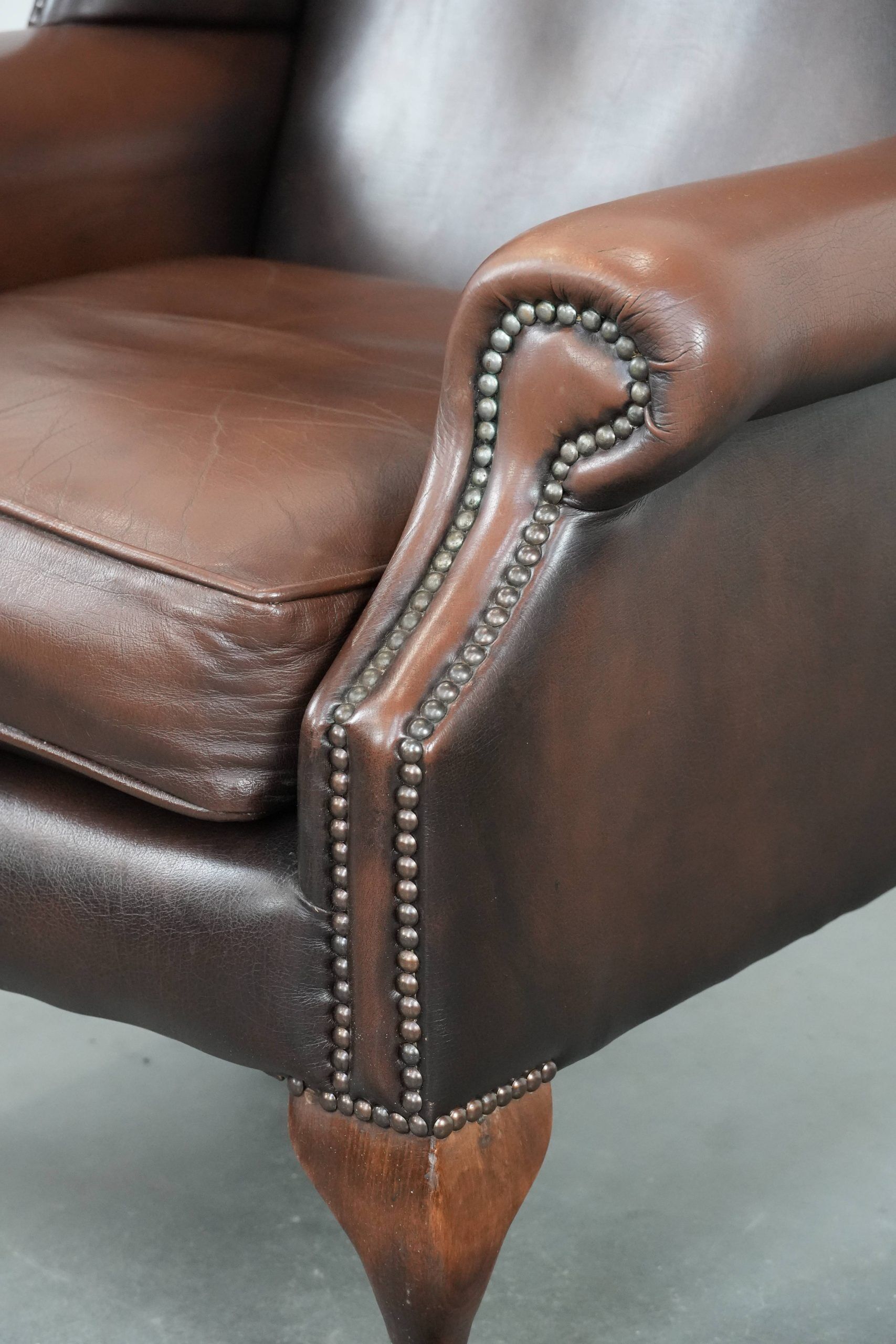 Brown smooth cow leather Chesterfield wingback armchair in English style