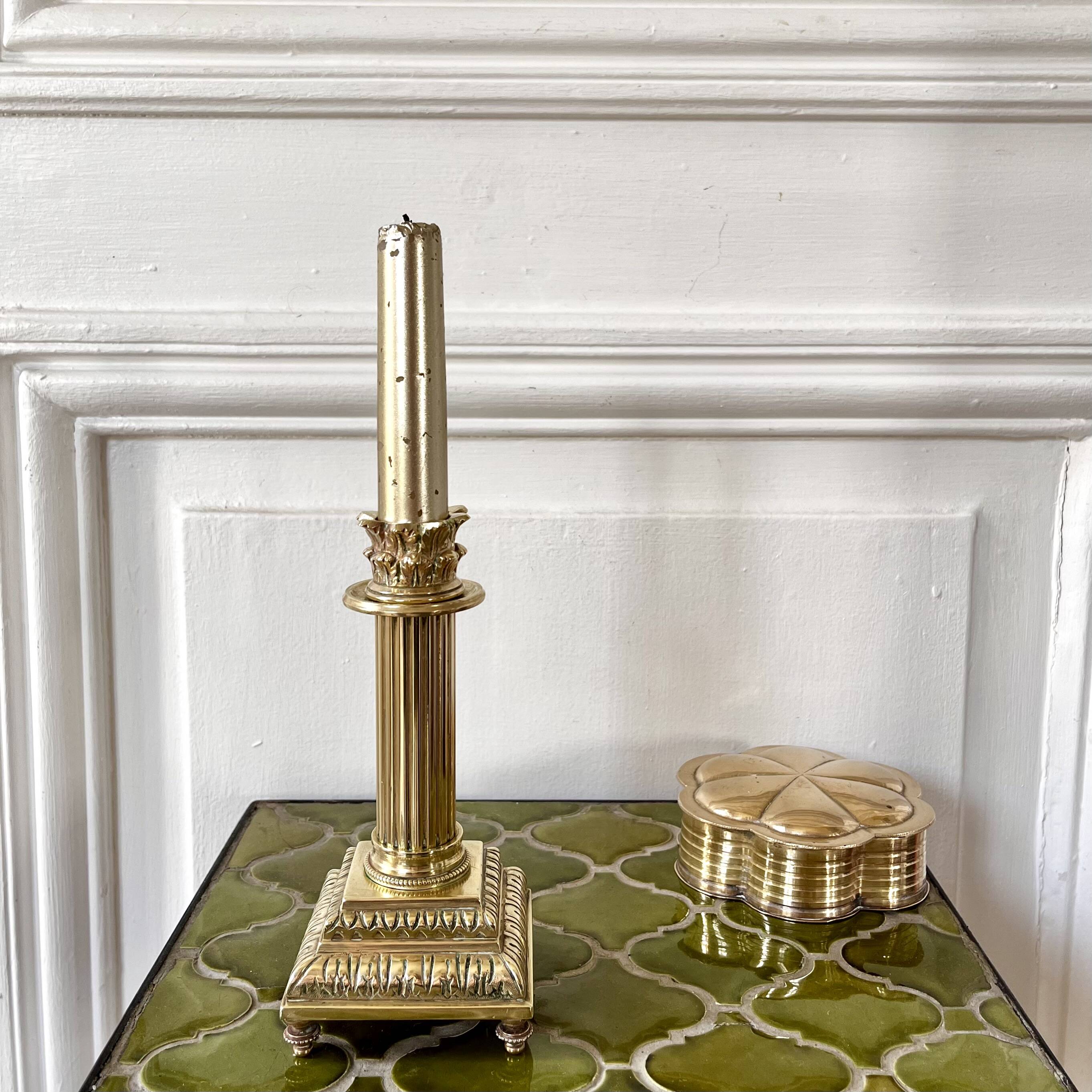 Empire style gold candle holder