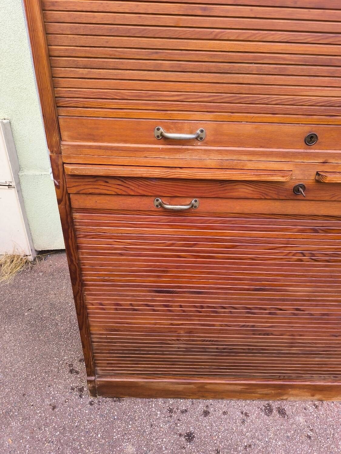 Vintage 1940s secretary desk with wooden curtains, storage, and shutters.