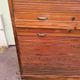 Vintage 1940s secretary desk with wooden curtains, storage, and shutters.