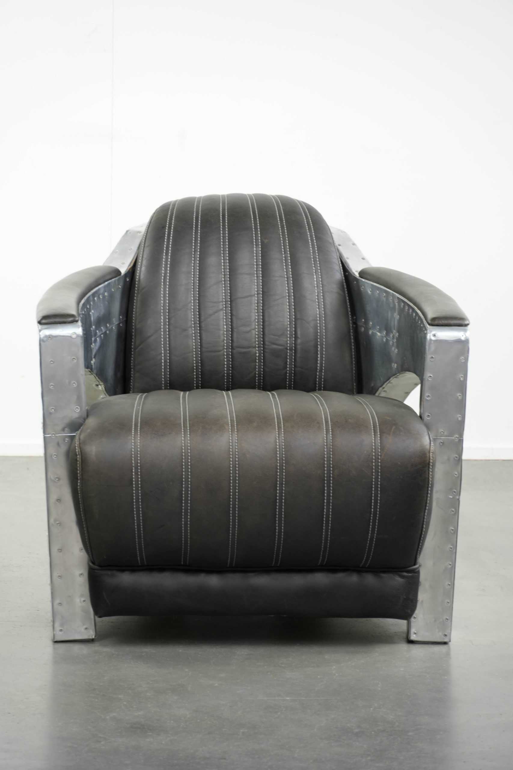 Comfortable cow leather aviator design armchair finished with aluminium