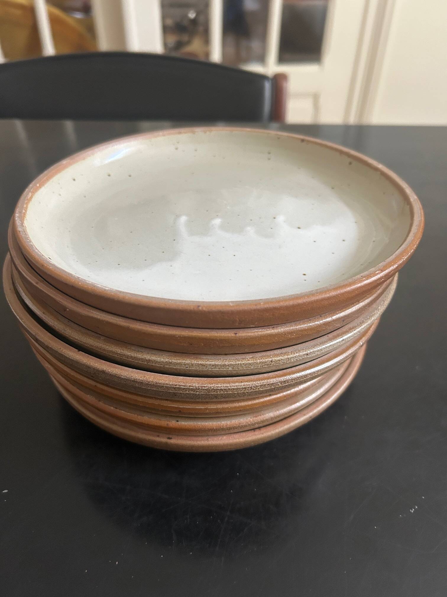 7 stoneware plates 1970