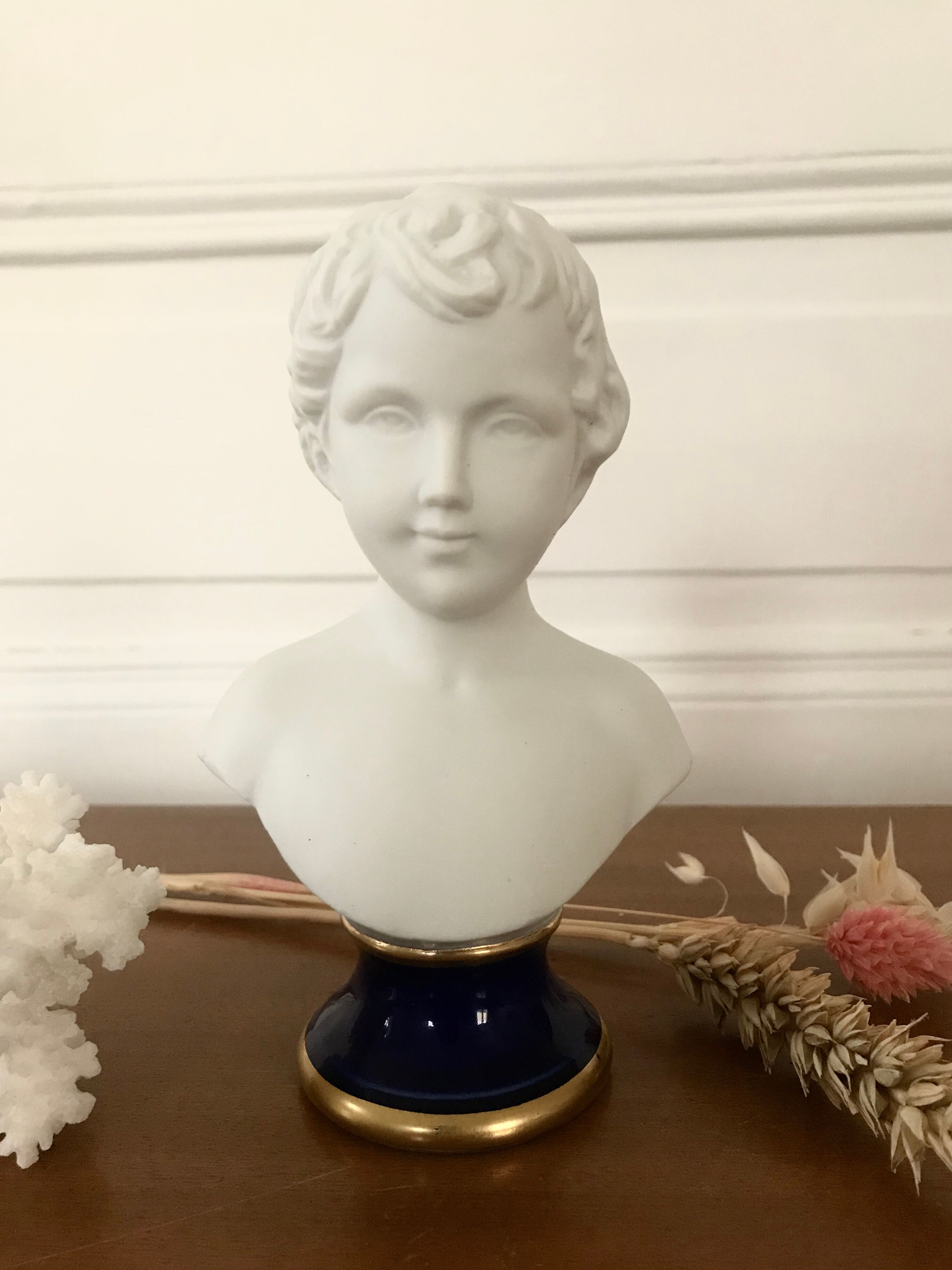 Ancient statuette bust in biscuit