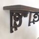 antique oak wall shelf with carved brackets