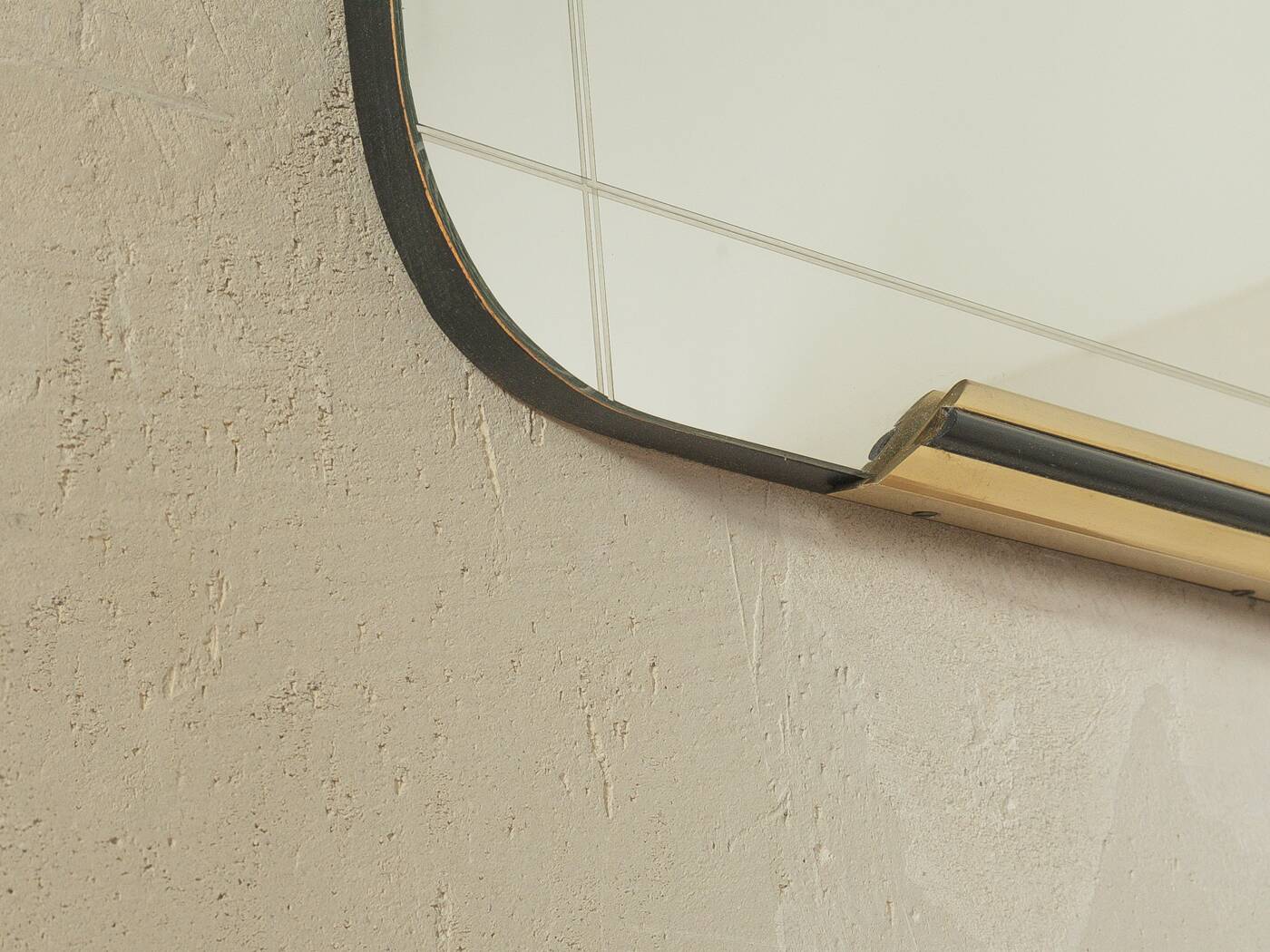 Classic 1950s mirror in black lacquered wooden frame with two brass elements