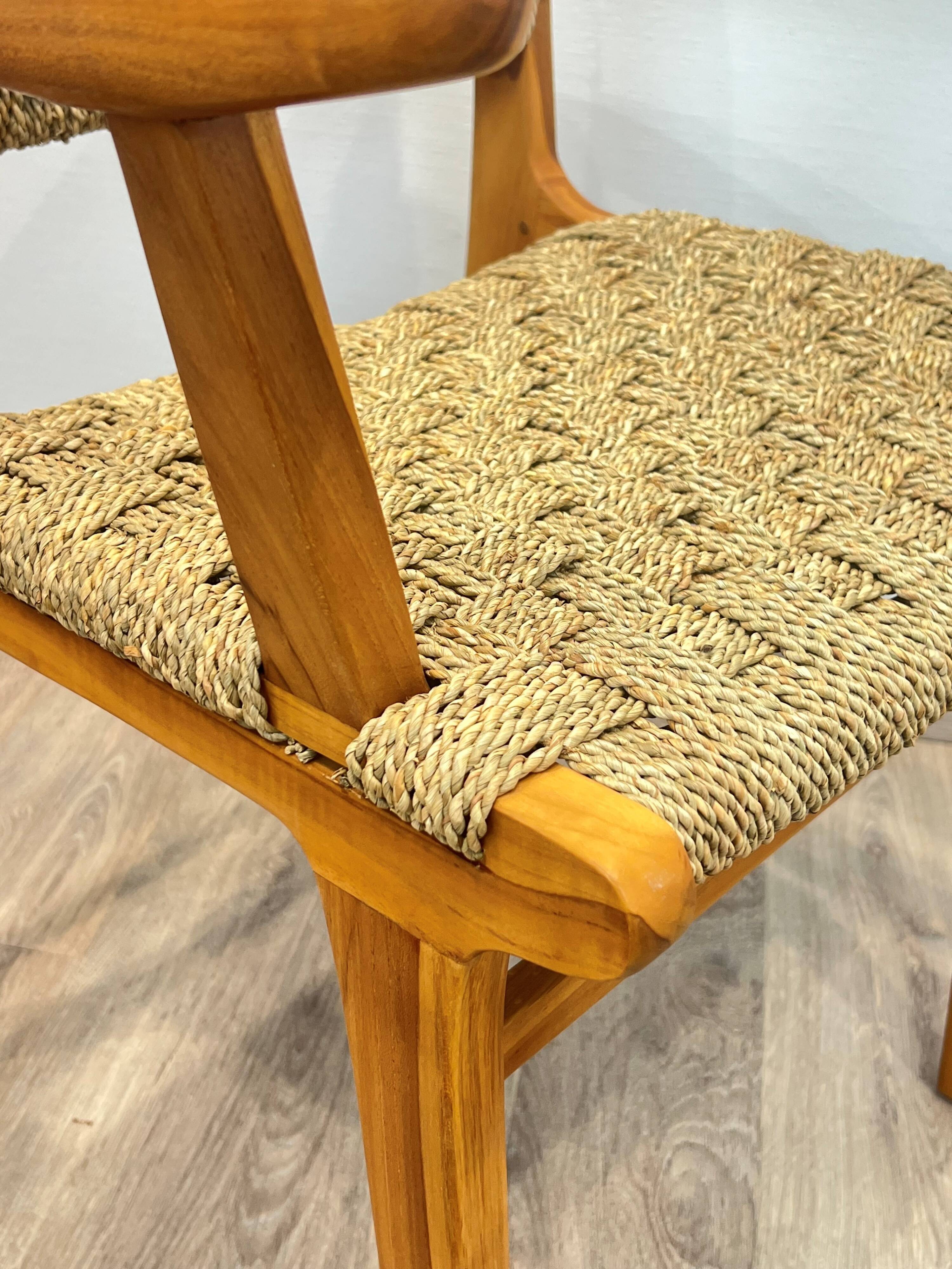 Pair of woven teak armchairs