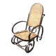 Vintage Thonet rocking chair in cane and bent wood.