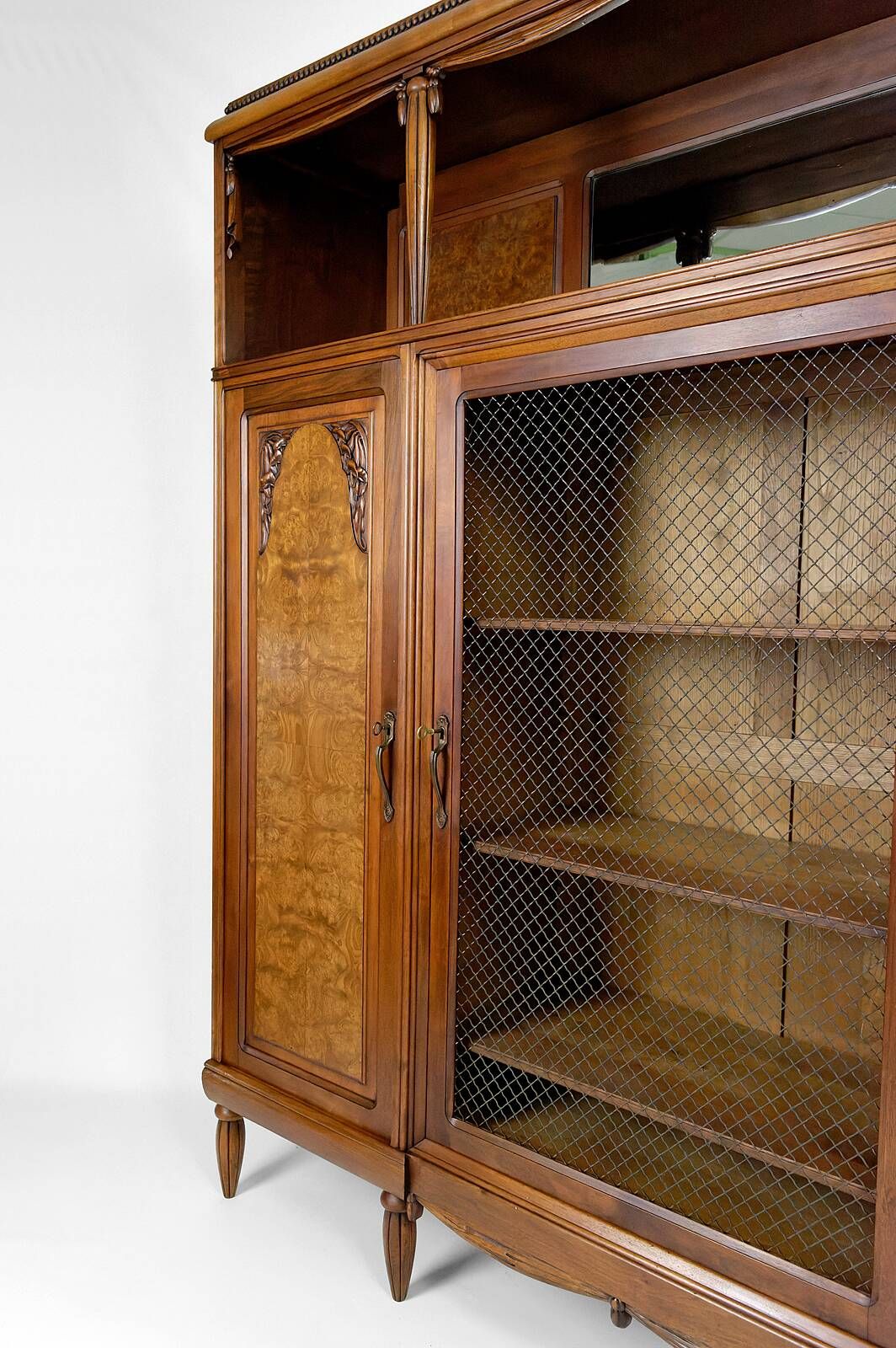 Art Deco showcase bookcase in carved walnut, France, circa 1925