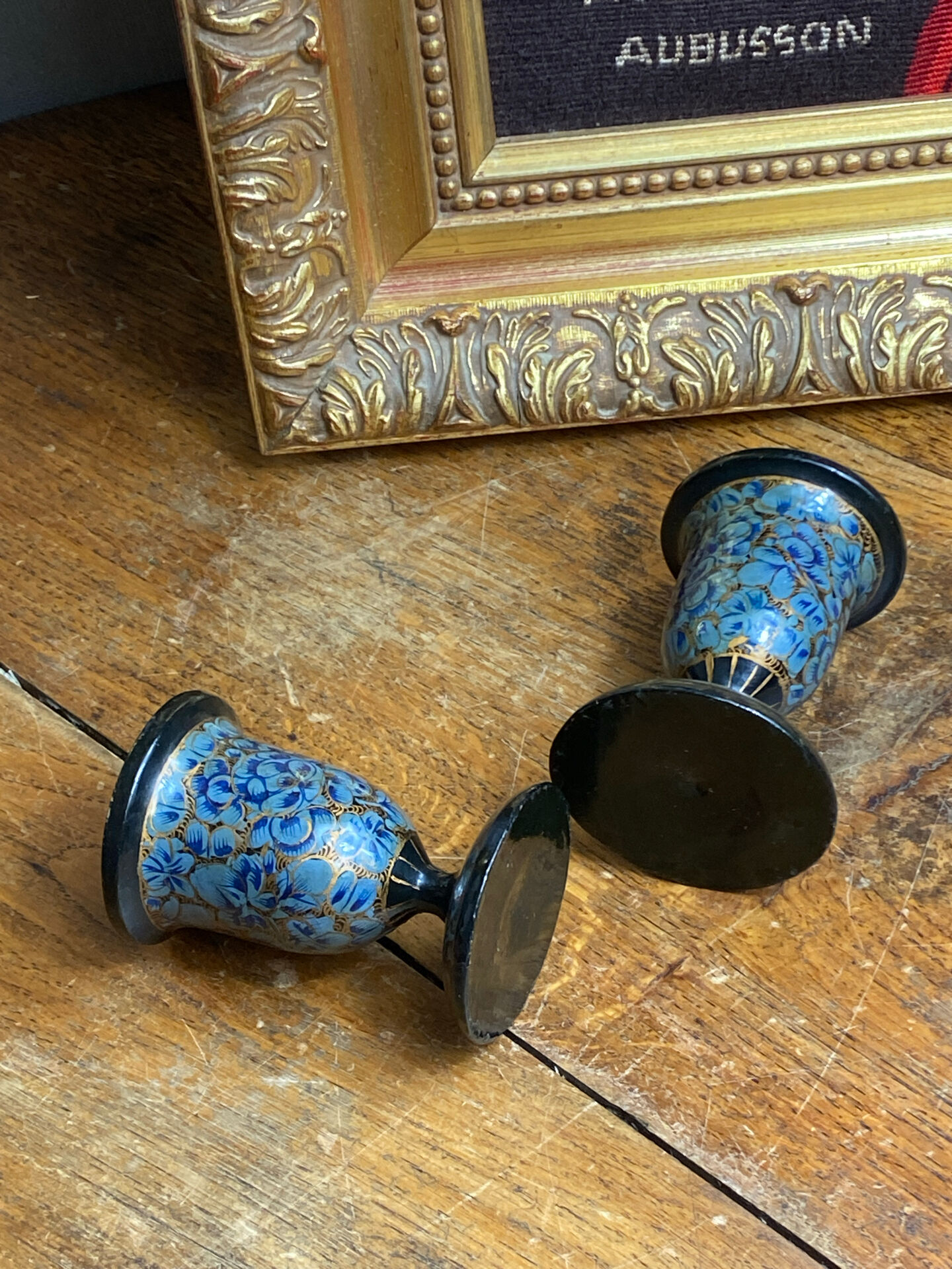Pair of Kashmiri candlesticks, lacquered papier-mâché