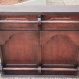 Bar counter in solid exotic teak wood; molded panel decor.