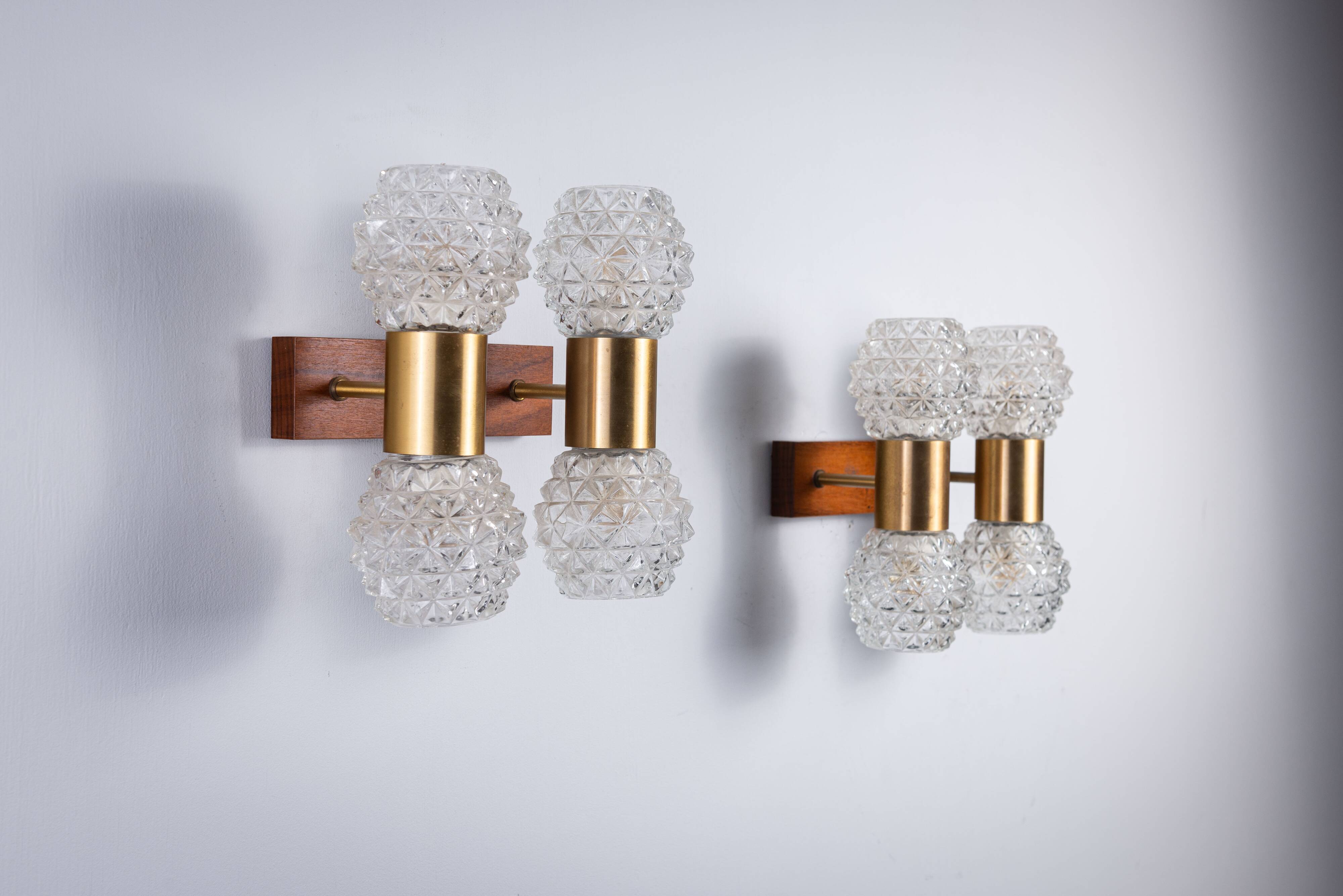 Pair of Swedish wall lamps with teak wood, brass and glass cup shade