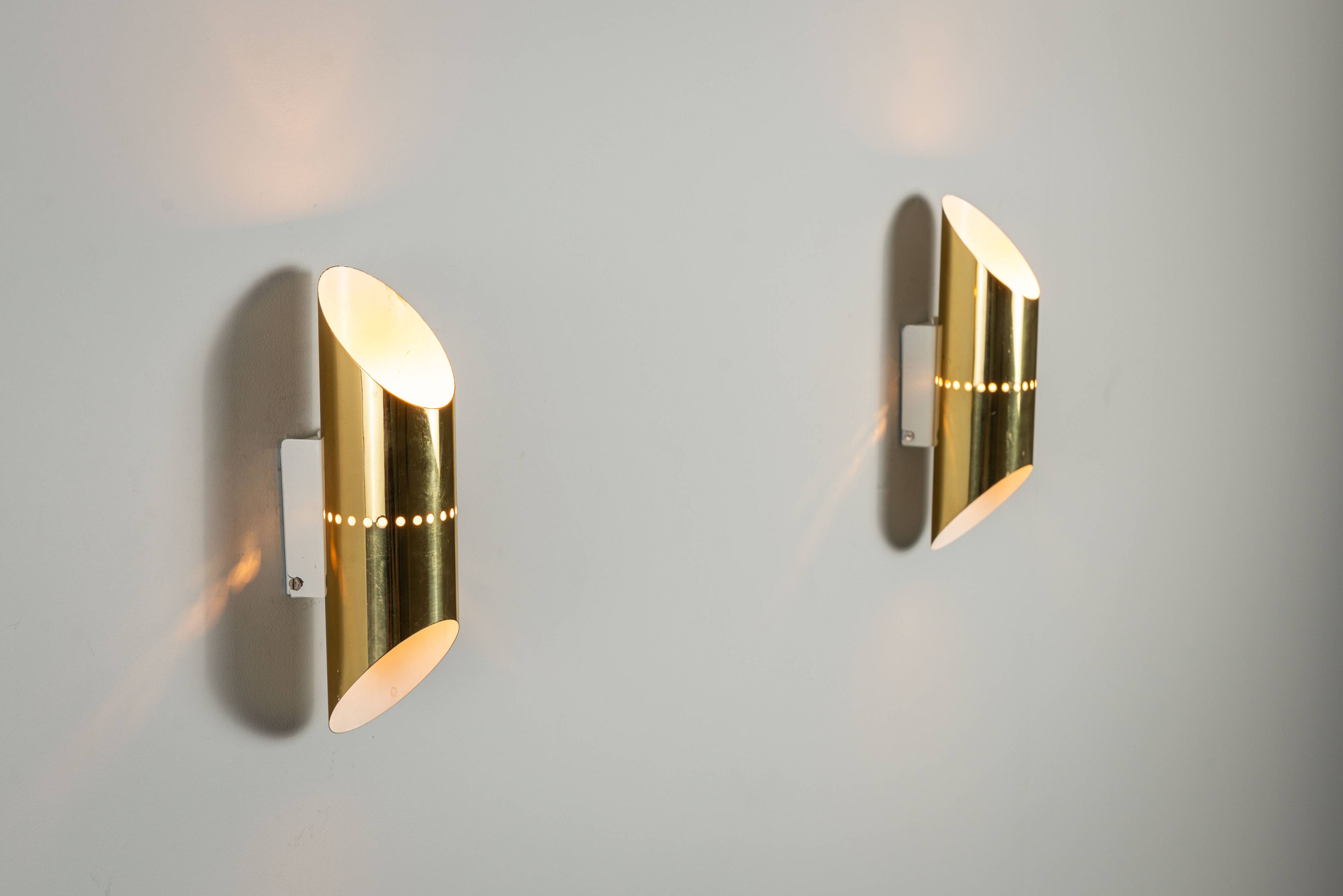 Pair of cylindrical wall lamps in brass with perforated shades