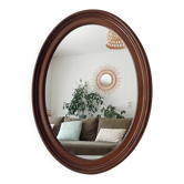 Vintage oval wooden mirror from the 1960s.