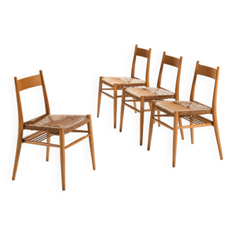 Set of four oak dining chairs with papercord seats
