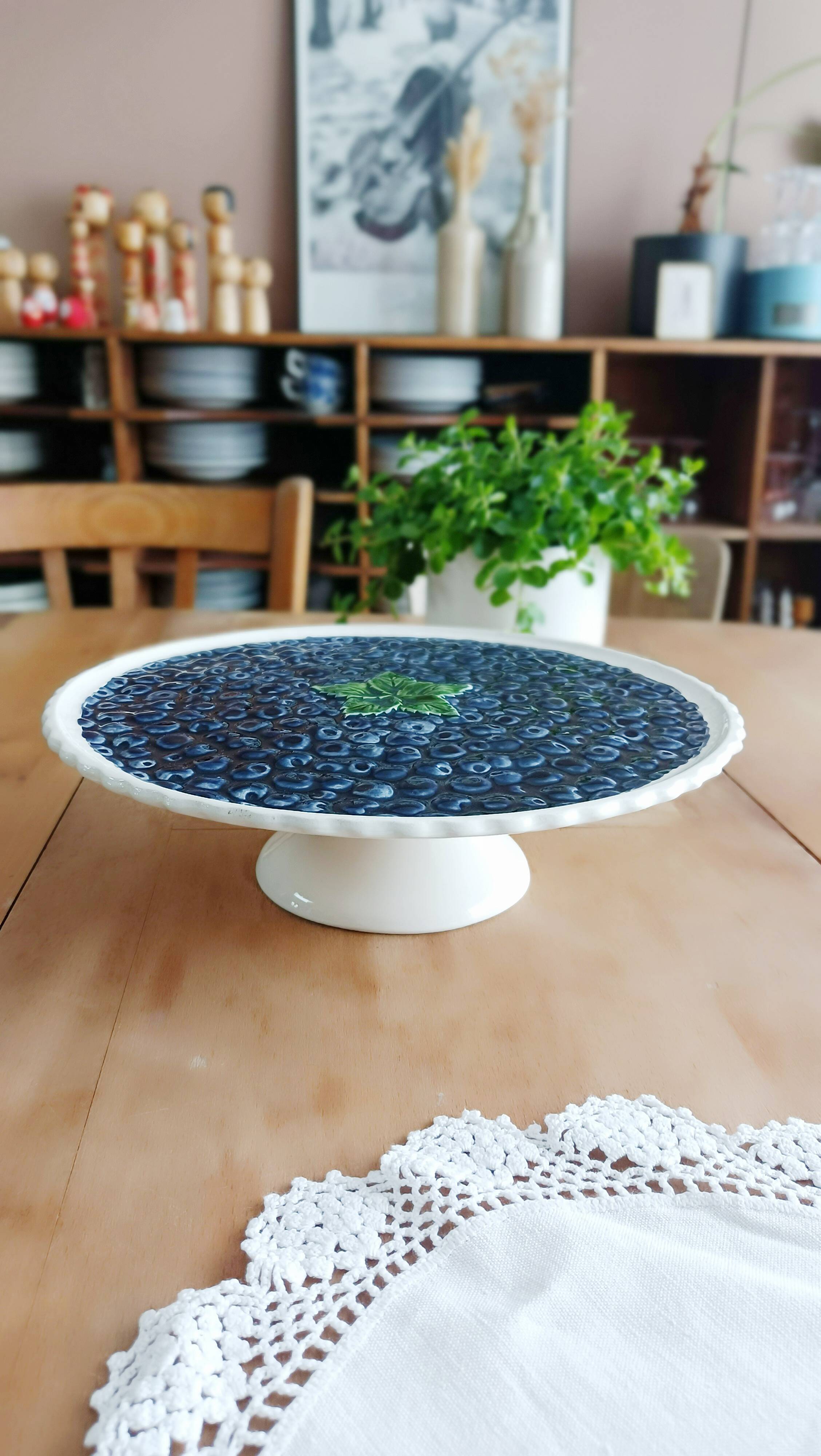 Pie dish on foot, in slip with blackberry decoration