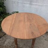 Round table with folding sides