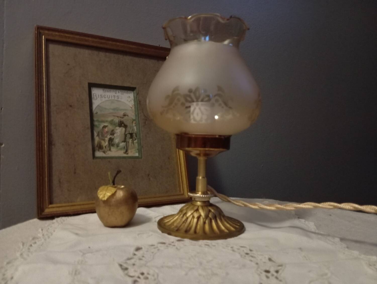 Bronze foot table lamp, satin amber lampshade, circa 1960